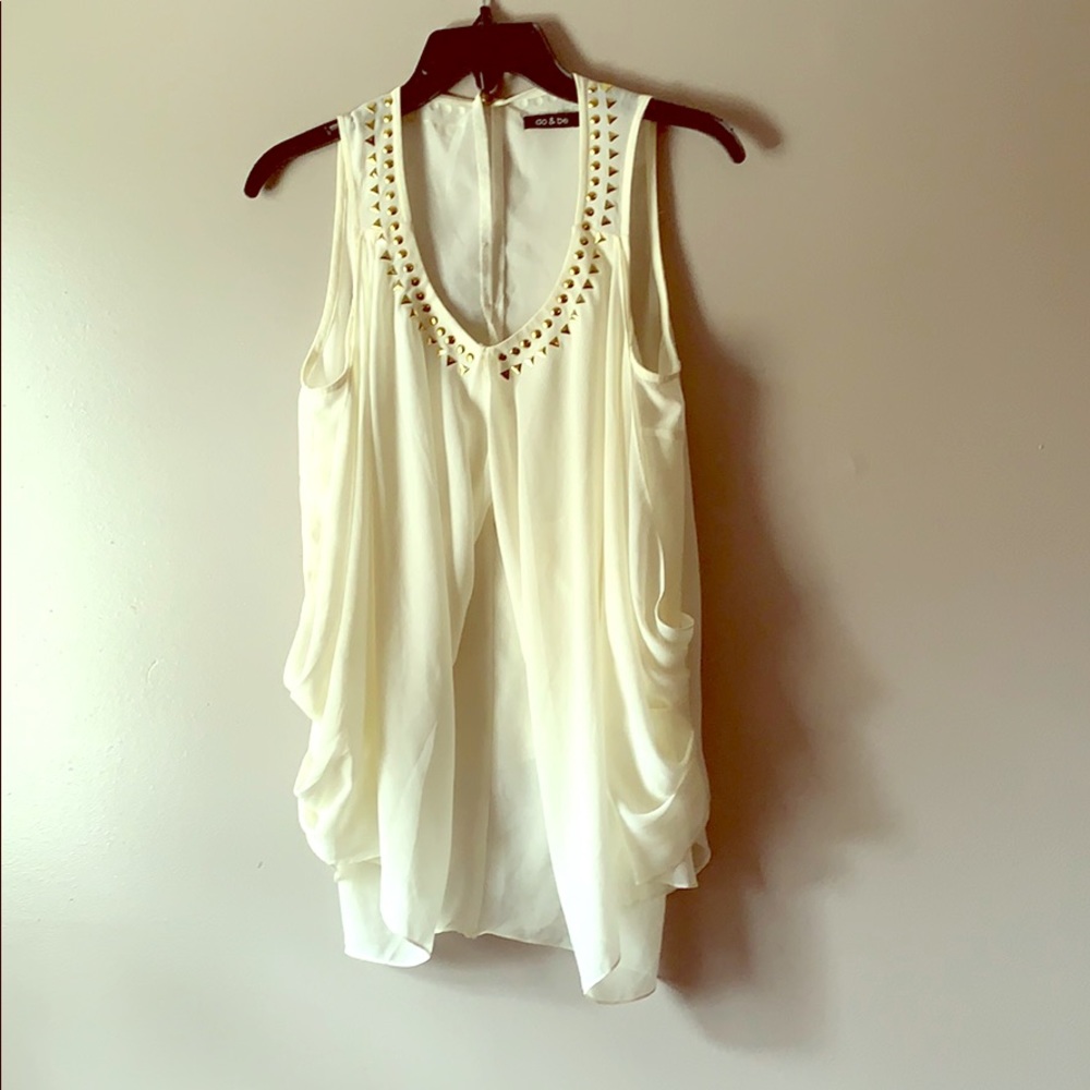 Cream, chiffon top, with gold studs.